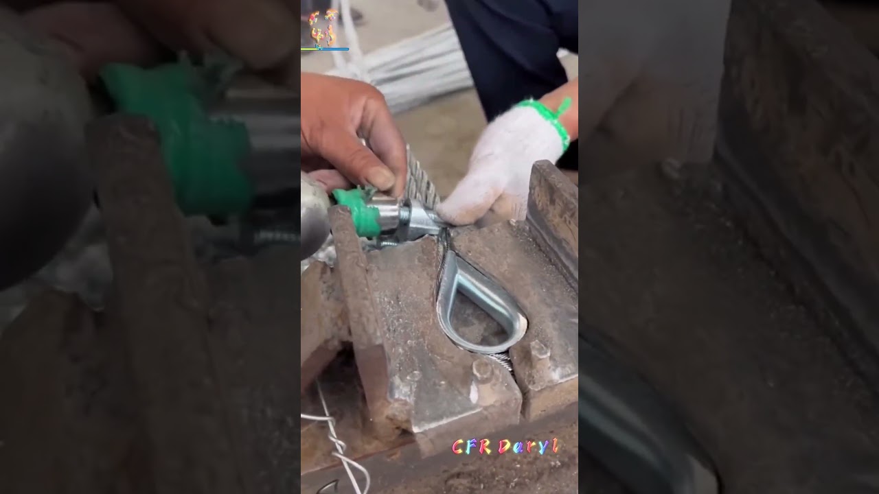 Two workers assemble the wire rope clamp anchor rod together