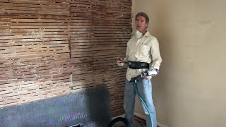 Plastering interior walls for strength with stucco.