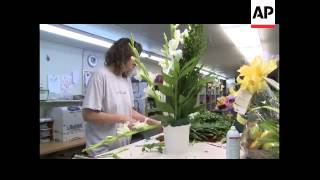 The AP''s Carolyn Kaster visits a flower shop in Beckley, W.Va. that is handling orders for funerals