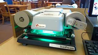 Using a ScanPro 3000 Microfilm Viewer in the Rundell Building of the Central Library on South Avenue