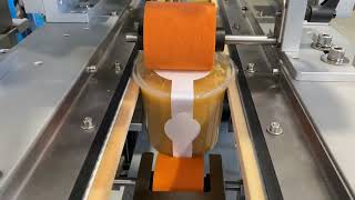 Labelling system for high speed application onto plastic pots