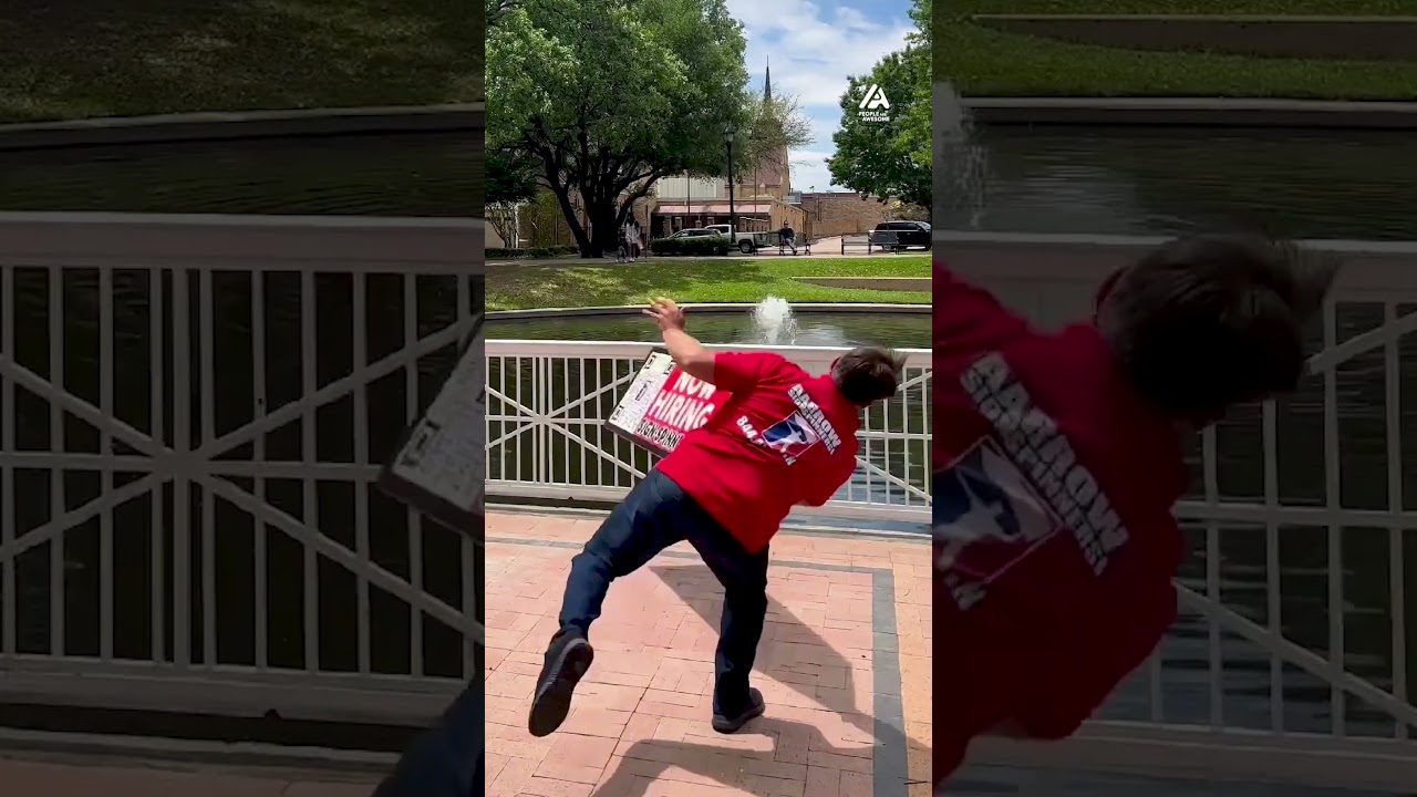 Sign Spinner Displays Impressive Skills