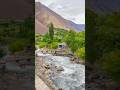 Crystal-clear waters weaving through emerald valleys, nature at its purest #arrahman #mountains #fyp