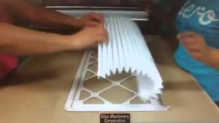 Z Gluer applying glue to filter board to produce furnace filters
