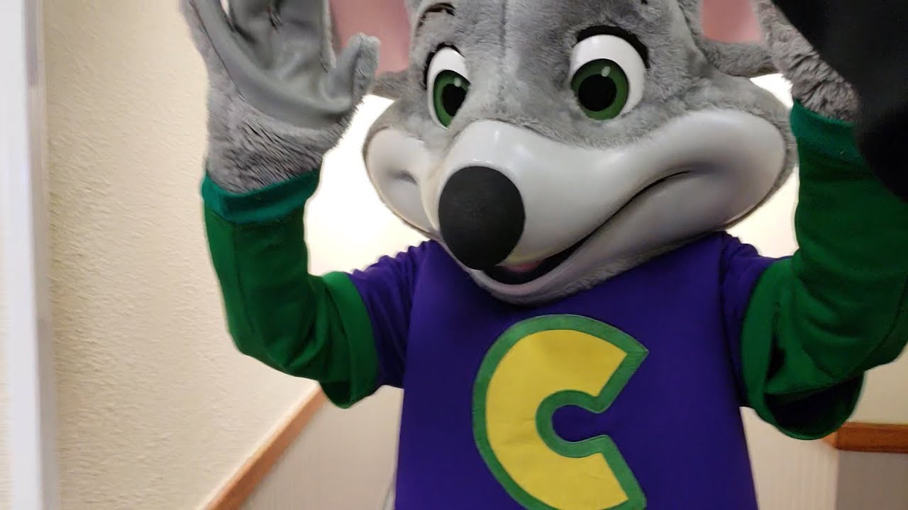 Chuck E CHeese is so sad so i gave him a High Five Chuck e cheese