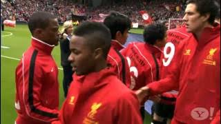 Suarez and Evra shake hands
