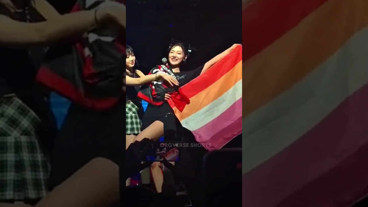 ningning holding up the pride and lesbian flags