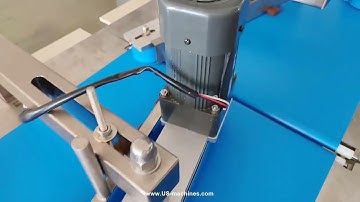 Running video of automatic chocolate bar cookie sorting conveyor feeding conveyor