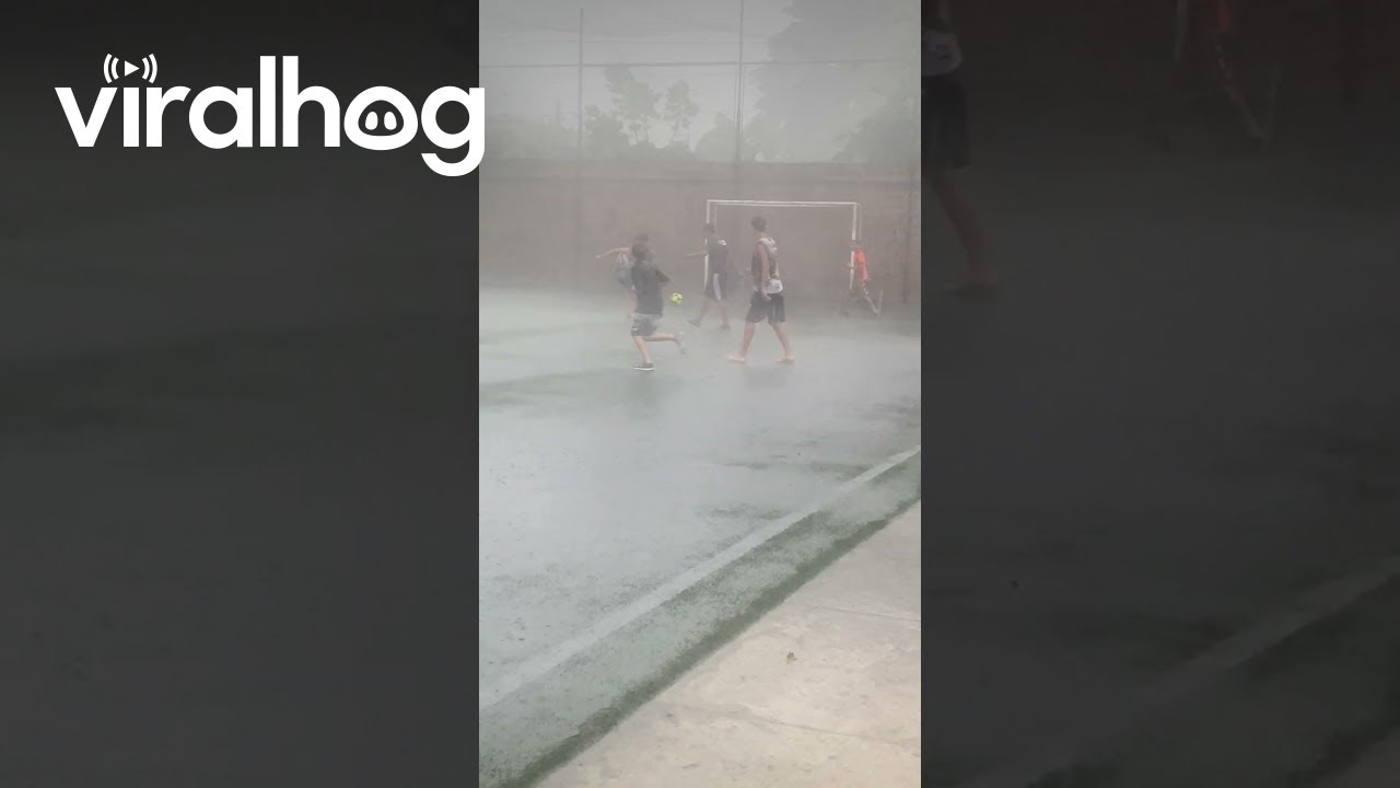 Playing Football In The Pouring Rain || ViralHog
