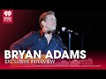 Capture de la vidéo Bryan Adams On His New Album 'Roll With The Punches' & Elizabeth Hurley Starring In His Music Video