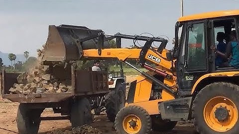JCB 3DX Super Loading stone into a dump truck