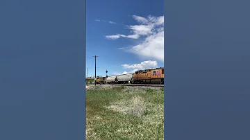 UP DPU shoves it’s train past a waiting freight - Clearfield, UT.  5/15/24