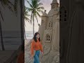 banana-house built entirely from sand, detailed sand architecture with realistic textures