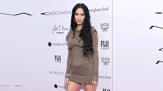 Megan Fox Poses in an Ultra Plunging Wrap Bra and Whale Tale Shorts With a Necklace Made of Nails