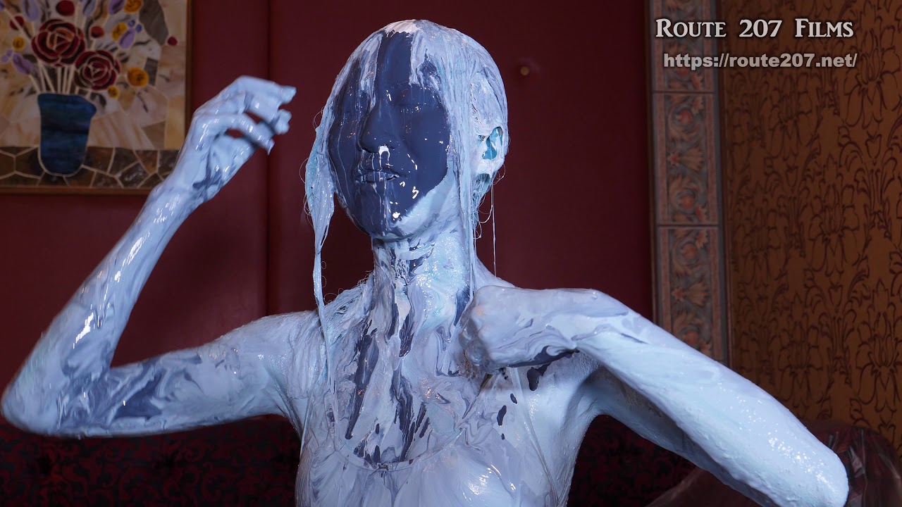 Natural-born Video #9 - A video of a Japanese model wearing a blue swimsuit, pouring paint on herself for almost 18 minutes. Body paint performance.
