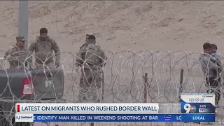 Latest on migrants who rushed border wall