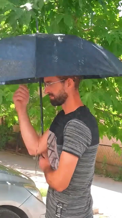 holding umbrella for modi