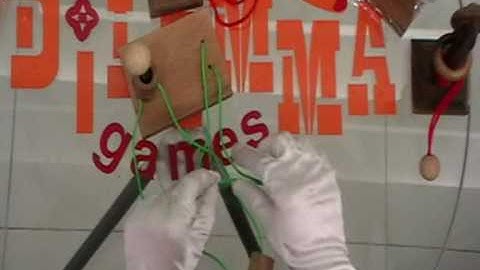 DILEMMA GAMES GORDIAN KNOT RING AND STRING PUZZLE SOLUTION