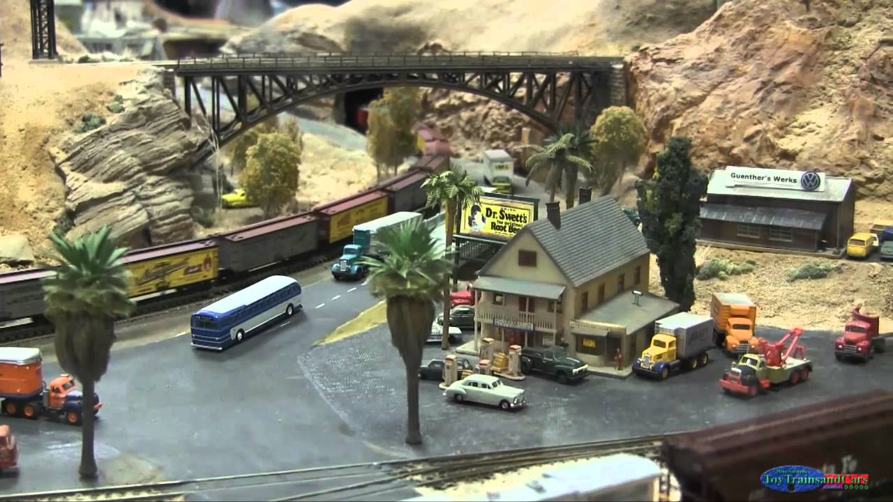 N Scale Model Train: Steam Train Going Under A Bridge Through Town ...