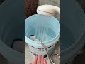 A portable shower draws water from a bucket, making it easy to wash feet or anything anywhere #viral