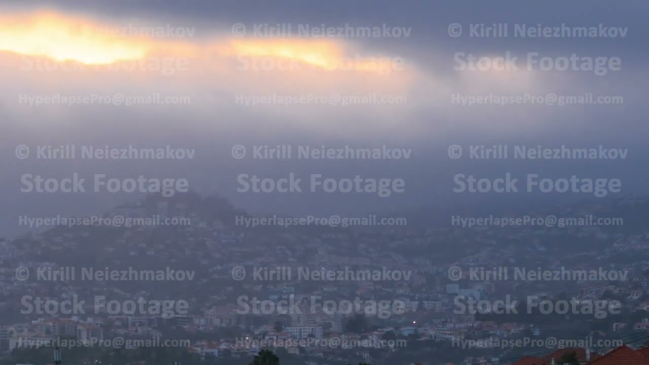 Sunset over houses from hill in Funchal, Madeira, Portugal timelapse