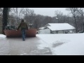 Hack for shoveling snow off driveway with sheet of plywood.