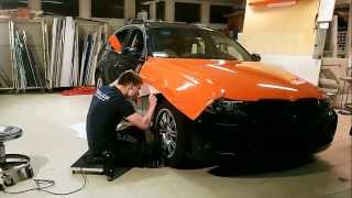 Auton yliteippaus - BMW gloss orange car wrap Resimi