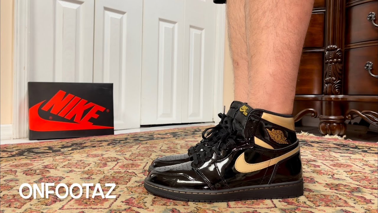 black and gold jordan 1 on feet