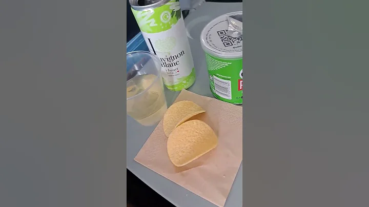 Tui Boeing 737. Ploughmans lunch sandwich white wine and pringles at 34000 feet.