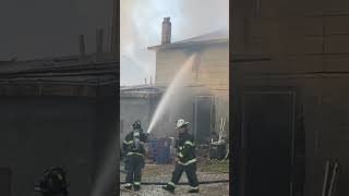 Firefighters putting out a house fire