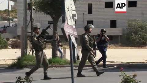 Palestinian protesters clash with Israeli troops