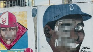 Community take action on defaced historic murals