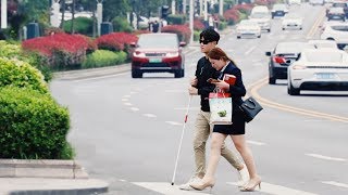 What will happen when a blind man cross the road alone in China?