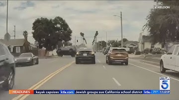 Video captures BMW run stop sign, cause multi-car crash in South L.A.