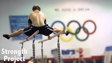 Gymnastics Parallel Bar Skills: kip to straddle l