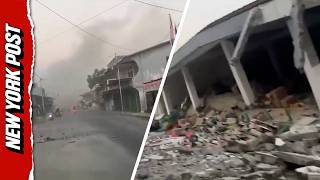 Devastated Woman Breaks Down in Tears Riding Through Deadly Indonesia Eart uake Damage