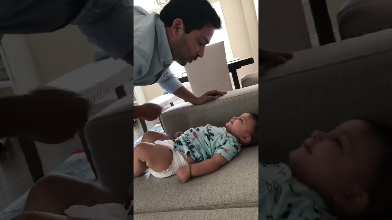 Baby refusing his dad to clean face
