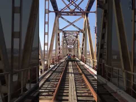 Russian diplomats push rail trolley across border to leave North Korea