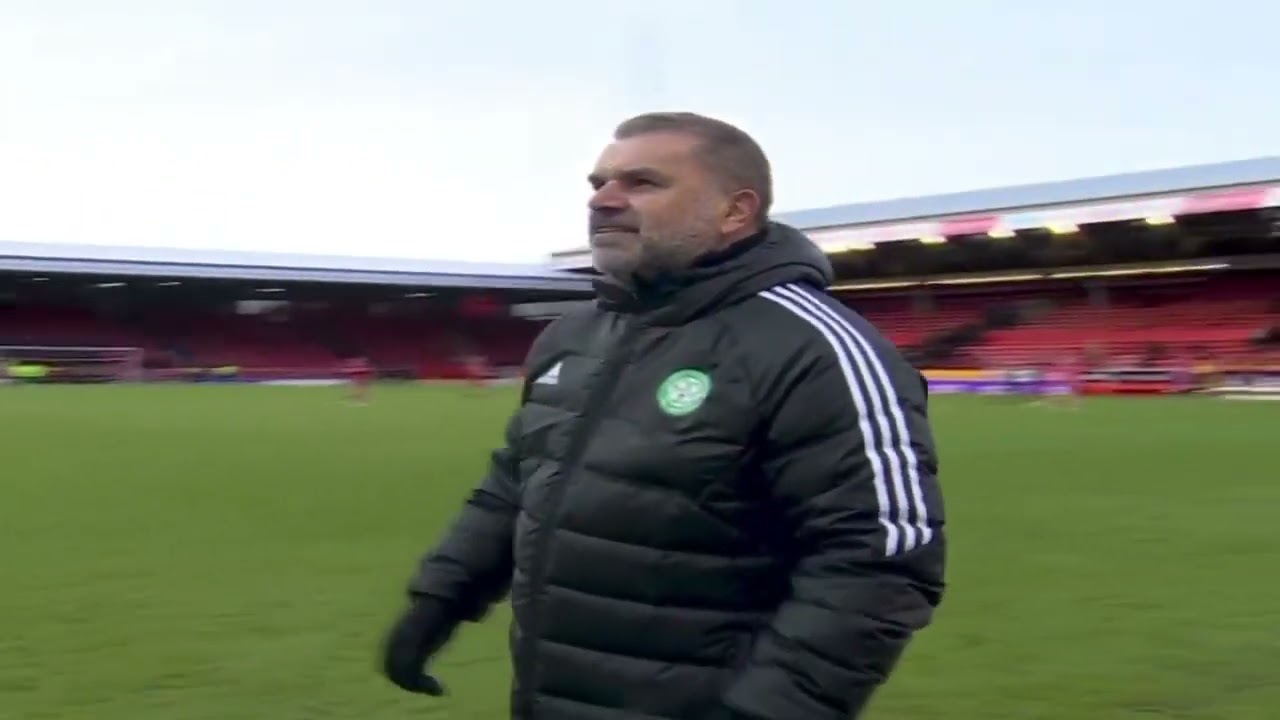 Ange Postecoglou celebrating with fans after Celtic defeat Aberdeen, Away from home to make it -9