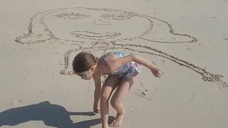 Kids playing on the beach. Funny video.