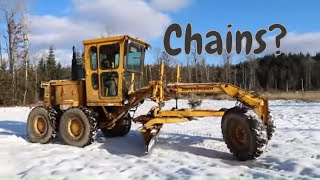 Snow Plowing With a Caterpillar Road Grader