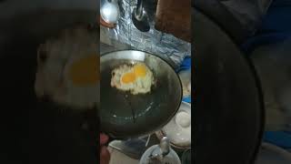 Person Flips Sunnyside Up Egg and It Falls Behind the Stove