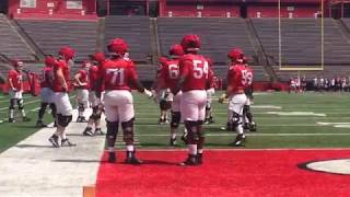 Rutgers football offensive line going through some drills during fall camp