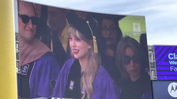 My fellow graduate, Taylor, gets her honorary degree from NYU
