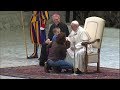 A boy interrupts the pope to touch a Swiss Guard's hand