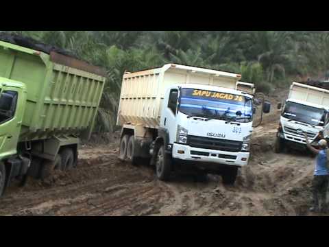 Isuzu FVZ 34 285 passing Hino FM 260 on mud road.