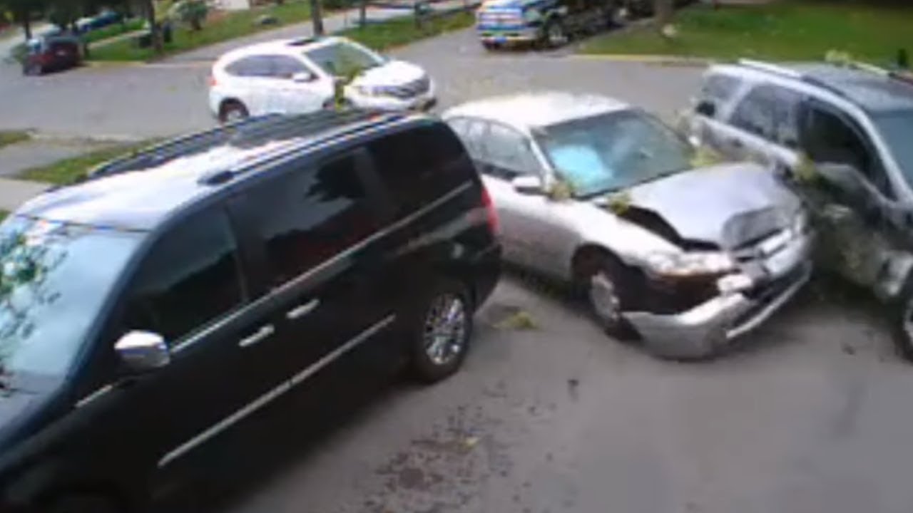 Distracted driver crashes into parked car - YouTube