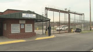Former inmate charged with flying drones