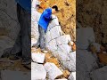 building a stone retaining wall with natural materials by arranging them carefully ensure stability