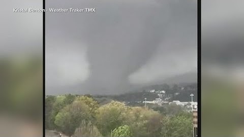 Dozens of tornadoes tear through Midwest and South